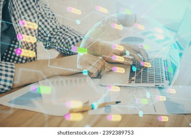 Multi exposure of world map hologram with man working on computer on background. Concept of worldwideweb.