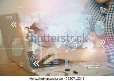 Multi exposure of world map hologram with man working on computer on background. Concept of worldwideweb.