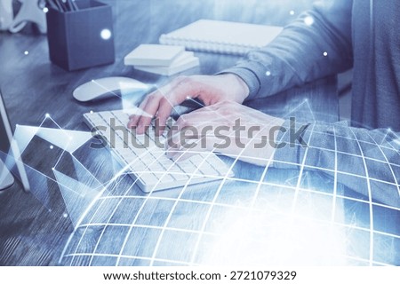 Multi exposure of world map hologram with man working on computer on background. Concept of worldwideweb.