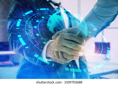 Multi exposure of world map on office background with two businessmen handshake. Concept of international business
