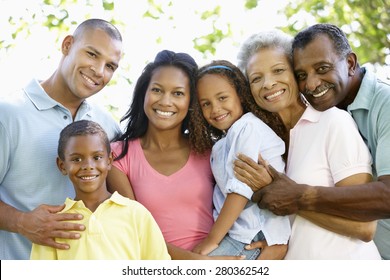 Multi Generation African American Family Walking In Park