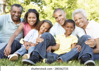 Multi Generation African American Family Relaxing In Park