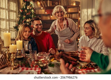 Multi Generation Big Family Having Fun At Christmas Supper Party - Winter Holiday X Mas Concept With Grand Parent And Children Eating Together At Home Dinner