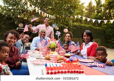 Multi Generation Black Family Having A 4th July Garden Party