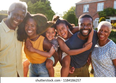 Multi Generation Black Family, Parents Piggybacking Kids