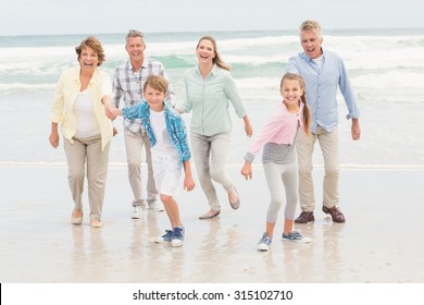 Multi Generation Family All Together At The Beach