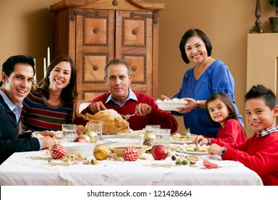 Multi Generation Family Celebrating With Christmas Meal