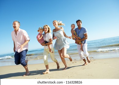 Multi Generation Family Enjoying Beach Holiday