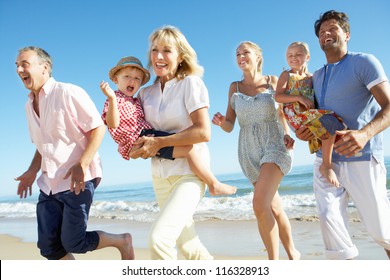 Multi Generation Family Enjoying Beach Holiday