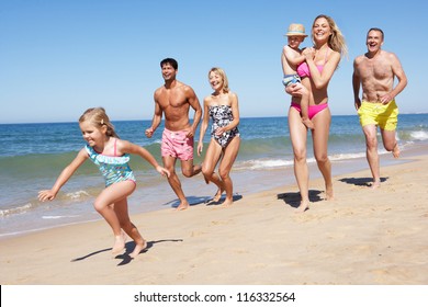 Multi Generation Family Enjoying Beach Holiday