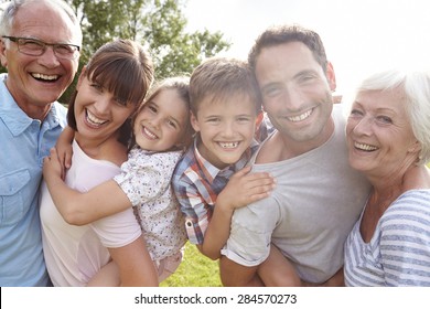 Multi Generation Family Giving Children Piggybacks Outdoors - Shutterstock ID 284570273