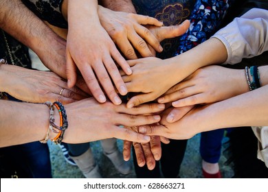 Multi generation family hands together on a heap - Shutterstock ID 628663271