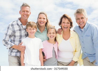 Multi Generation Family Happy And Smiling At The Beach