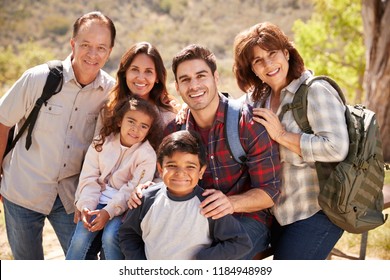 Multi Generation Family Hiking By A Mountain Lake, Portrait