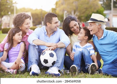 Multi Generation Family Playing Soccer Together