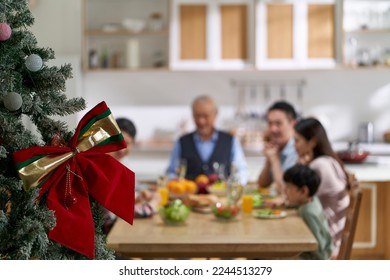 multi generational asian family gathering together having meal on christmas day - Powered by Shutterstock