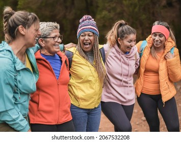 Multi generational women having fun at trekking day - Hiking multiracial friends enjoy day outdoor - Powered by Shutterstock