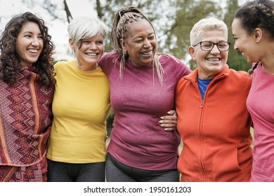 Multi generational women hugging each other at park - Multiracial people having fun outdoor - Powered by Shutterstock