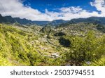 A multi image panorama of Sao Vicente sat in a deep valley of green mountains in the North of Madeira, Portugal.