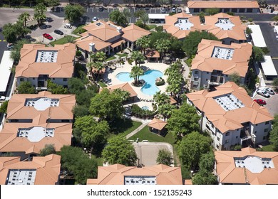 Multi Level Apartment Living With Swimming Pool And Volleyball As Viewed From Above