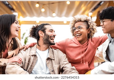 Multi racial friends having fun at fancy venue location - Life style concept with happy men and women sharing time together - College students on cool trendy vacations - Vivid backlight filter  - Powered by Shutterstock