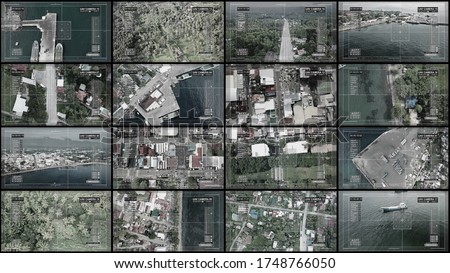 Multi screens, show us the top view of a small Asian city. CIA and cctv concept