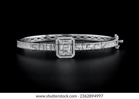 Multi stone baguette diamond bracelet on black background