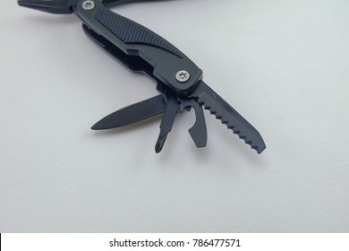 Multi tool in white background isolated,saw knife and screwdriver
