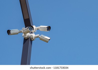 Multi-angle CCTV surveillance security camera video equipment on the blue sky background, copy space
