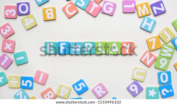 Multi-color Alphabet ABC letters and number and\
mathematics sign in square flat papers on white background with EF\
= PLAY at center.