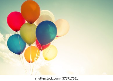 multicolor balloons with a retro instagram filter effect, concept of happy birthday in summer and wedding honeymoon party (Vintage color tone)