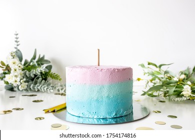 Multicolor cake with topper stick on white background with flowers, baby shower/birthday cake topper mockup - Shutterstock ID 1754174816