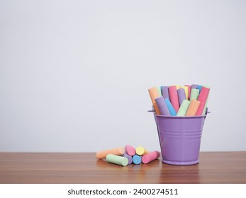 Multicolor chalk on wooden table for education background - Powered by Shutterstock