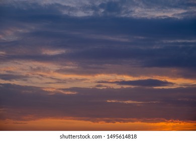 Multicolor Dramatic sky with dark clouds formations, sunset scene.