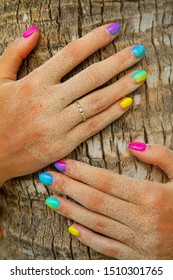 Multicolor gradient nails coconut palm tree background