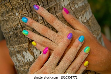 Multicolor gradient nails coconut palm tree background
