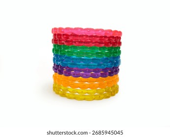 Multicolor plastic bangles set on white background, beautiful fashion accessory