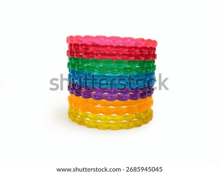 Multicolor plastic bangles set on white background, beautiful fashion accessory