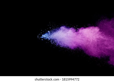 Multicolor powder explosion on black background. Colored cloud. Colorful dust explode. Paint Holi.