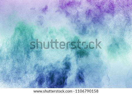 Multicolor powder explosion on white background. Colored cloud.Paint Holi. Colorful dust explode. 
