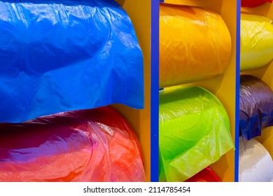 Multicolor rolls of polyethylene film in stock. Modern warehouse and storage systems.