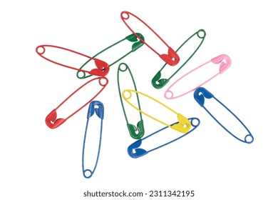 Multicolor safety pins isolated on white background. lots of colorful pins closeup