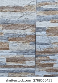 Multicolor split face stacked stone tile texture with visible perpendicular joint lines.
