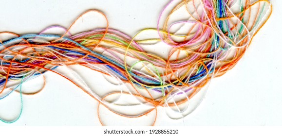 Multicolor tangled color needlecraft silk cord. Abstract color background, in white background	