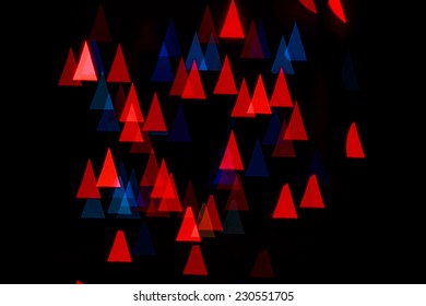 Multicolored abstract background of lights in the shape of triangles not in focus