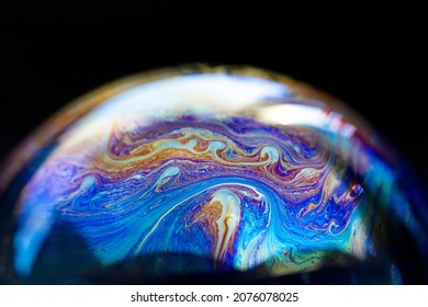 Multicolored abstract chaotic texture inside of the soap bubble, closeup - Shutterstock ID 2076078025