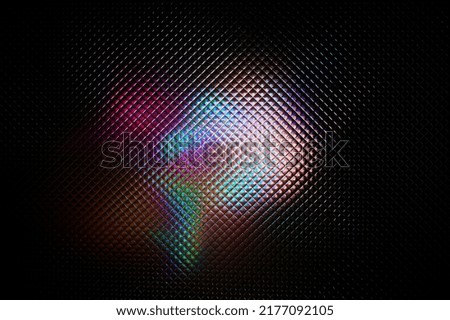 Multicolored abstract colorful pattern. Light glares with spectral gradient on a dark background.