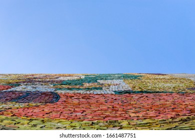 Multicolored abstract mosaic surface with high resolution with empty blue background. Mock up template for display or montage of product.