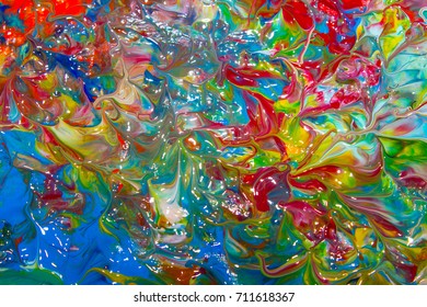 Multicolored abstraction of acrylic. Background. Texture.