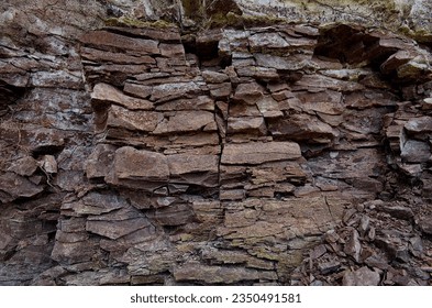 Multi-colored argillites and sandstones of the Devonian period on the territory of Western Ukraine. The pattern of the variegated argillites and sandstones - Geological layers of earth. - Powered by Shutterstock